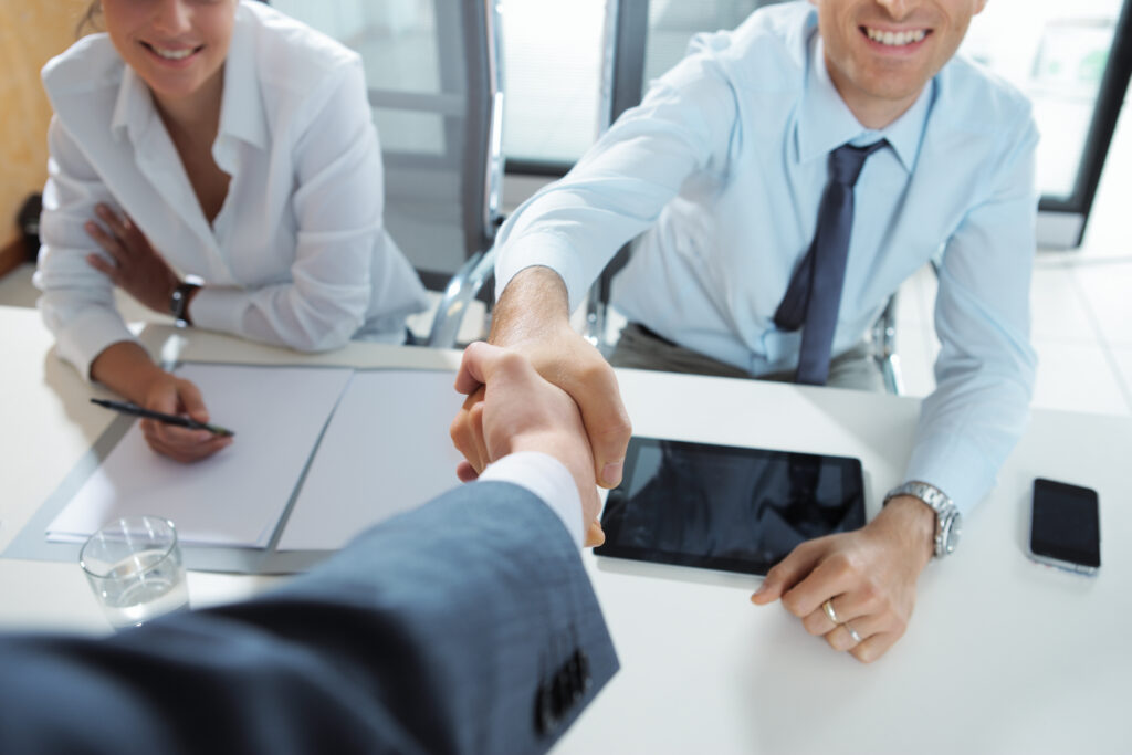handshake after getting hired for a direct marketing job