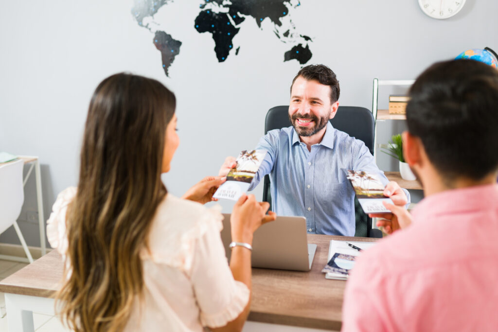 Sales rep providing print materials to customers